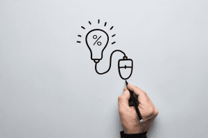 Person drawing lightbulb connected to a mouse