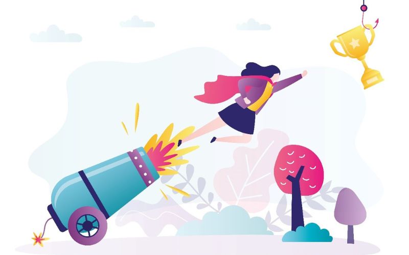woman being shot out of a cannon reaching for a trohpy