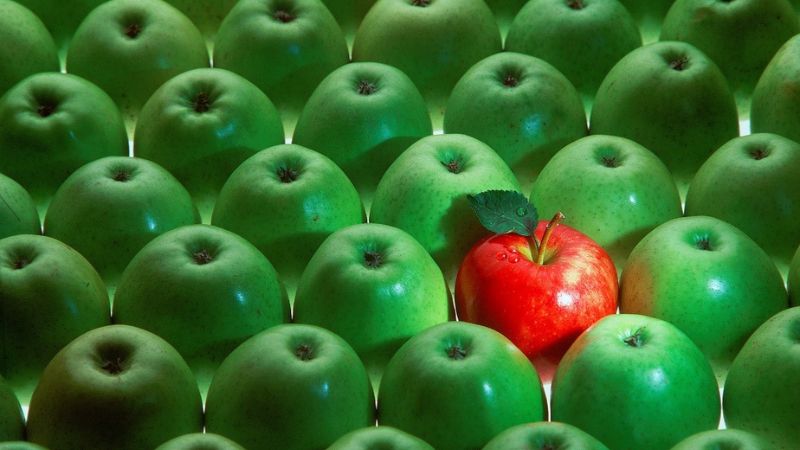 all green apples except for one red one