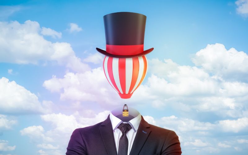 artistic image of a body with a hot air balloon with a top hat as the head