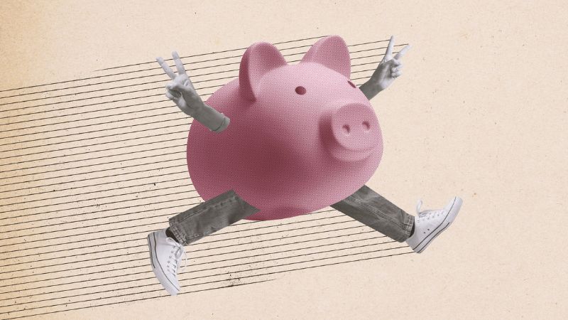 man running with a giant piggy bank oh him