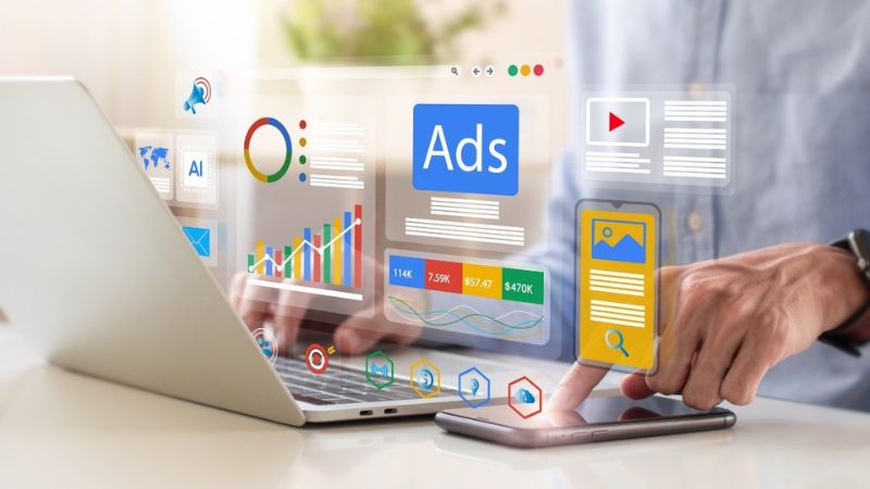 laptop open with icons reflecting seo