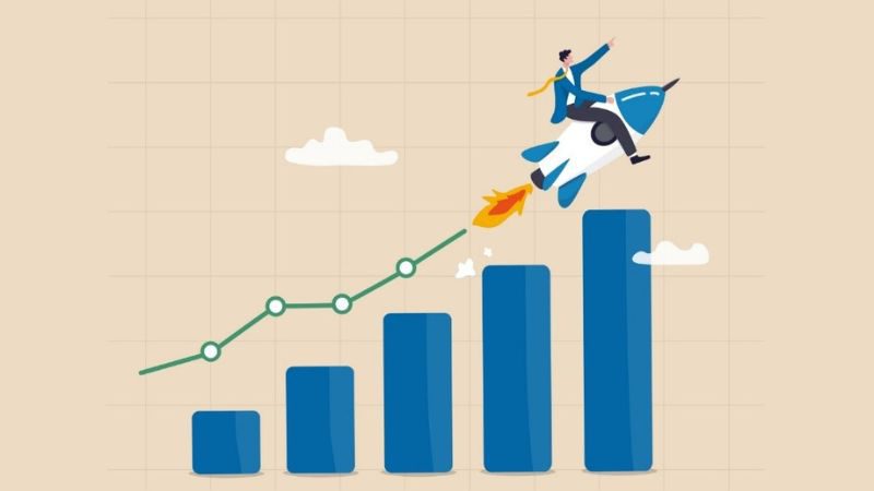 vector images on a rocket flying upward next to rising bar graph